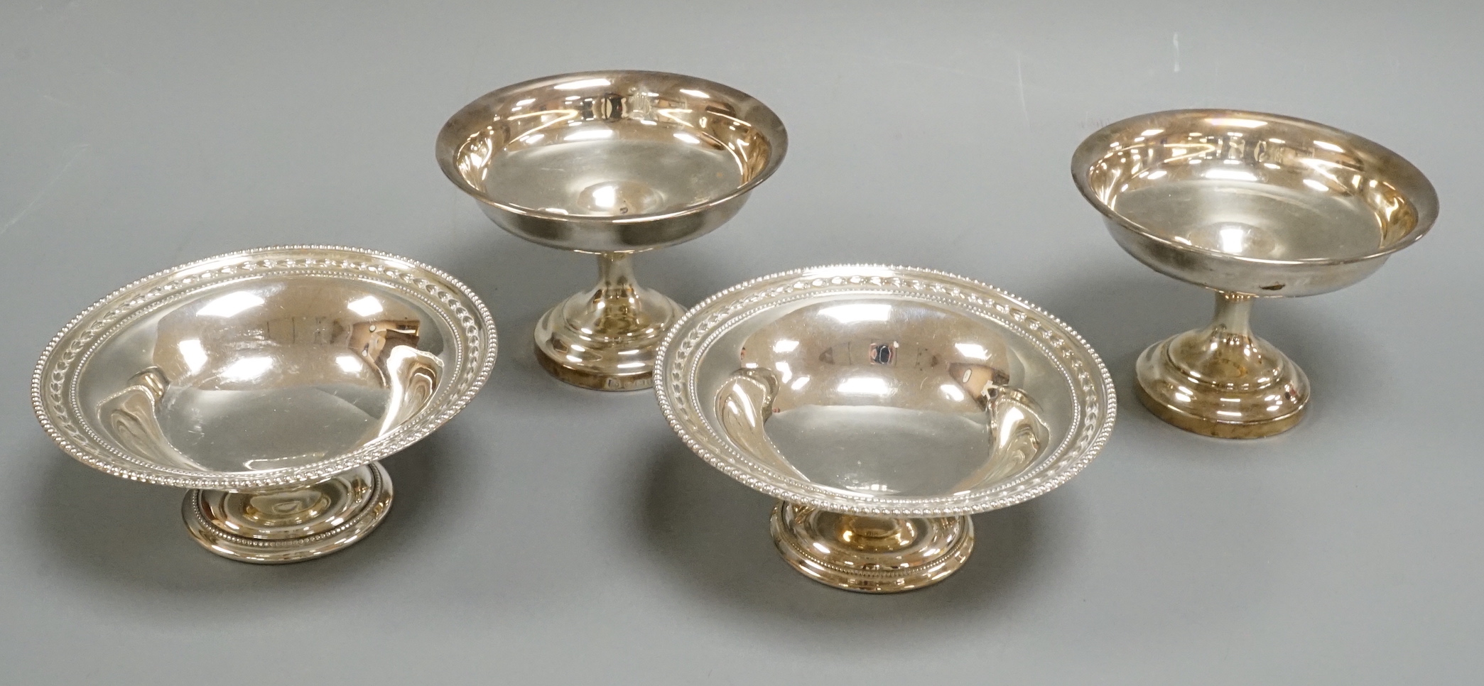 Two pairs of silver pedestal bonbon dishes, including James Dixon & Sons, Sheffield, 1898, diameter 11.4cm.